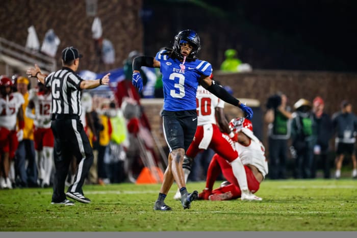 Duke Blue Devils nose tackle Brandon Johnson (3) celebrates his tackle against North Carolina State Wolfpack quarterback MJ Morris (7).